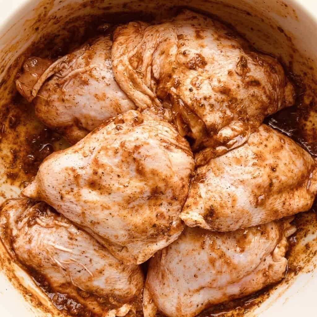Paprika chicken and potatoes cooked in oven or air fryer, seasoned with spices, ready to serve.