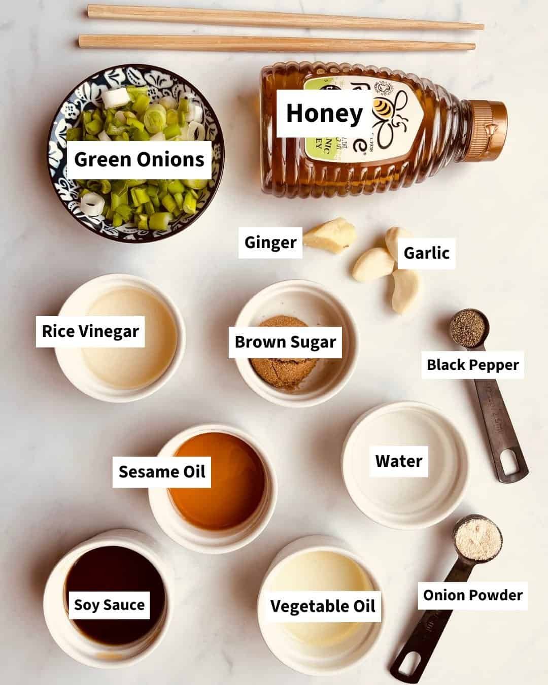 Ingredients for soy garlic chicken marinade including soy sauce, garlic, ginger, honey, and sesame oil