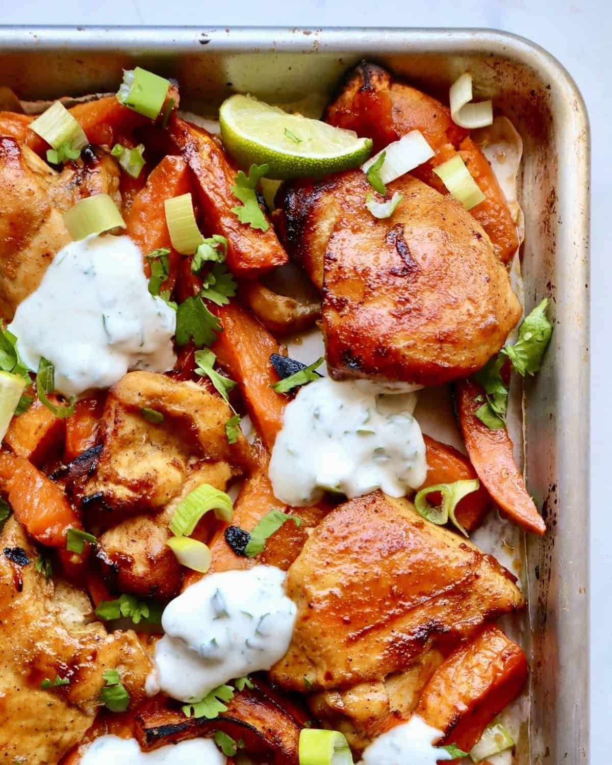 Sheet pan chili honey chicken with roasted sweet potatoes and cilantro yogurt sauce