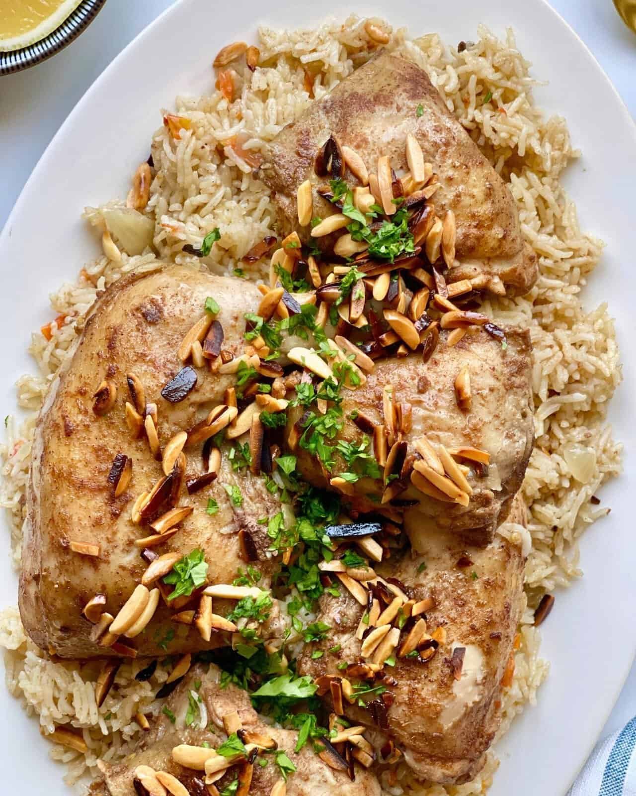 Grilled chicken thighs with almond slivers and fresh herbs over rice, delicious and easy to make.