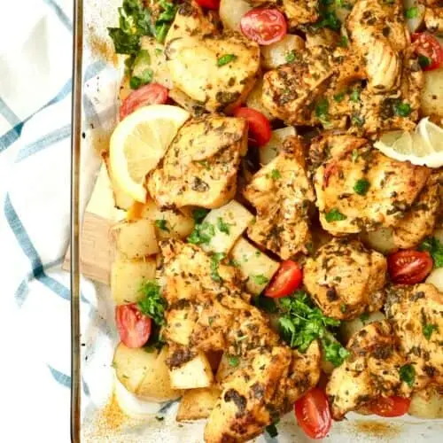 Golden, juicy Dump and Bake Mediterranean Chicken and Potatoes baked in one pan with garlic, lemon, and herbs for an easy weeknight dinner.