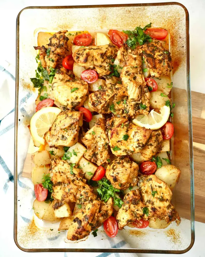 Easy dump and bake chicken and potatoes infused with lemon, garlic, and warm spices, perfectly golden, hearty, and ready to serve.