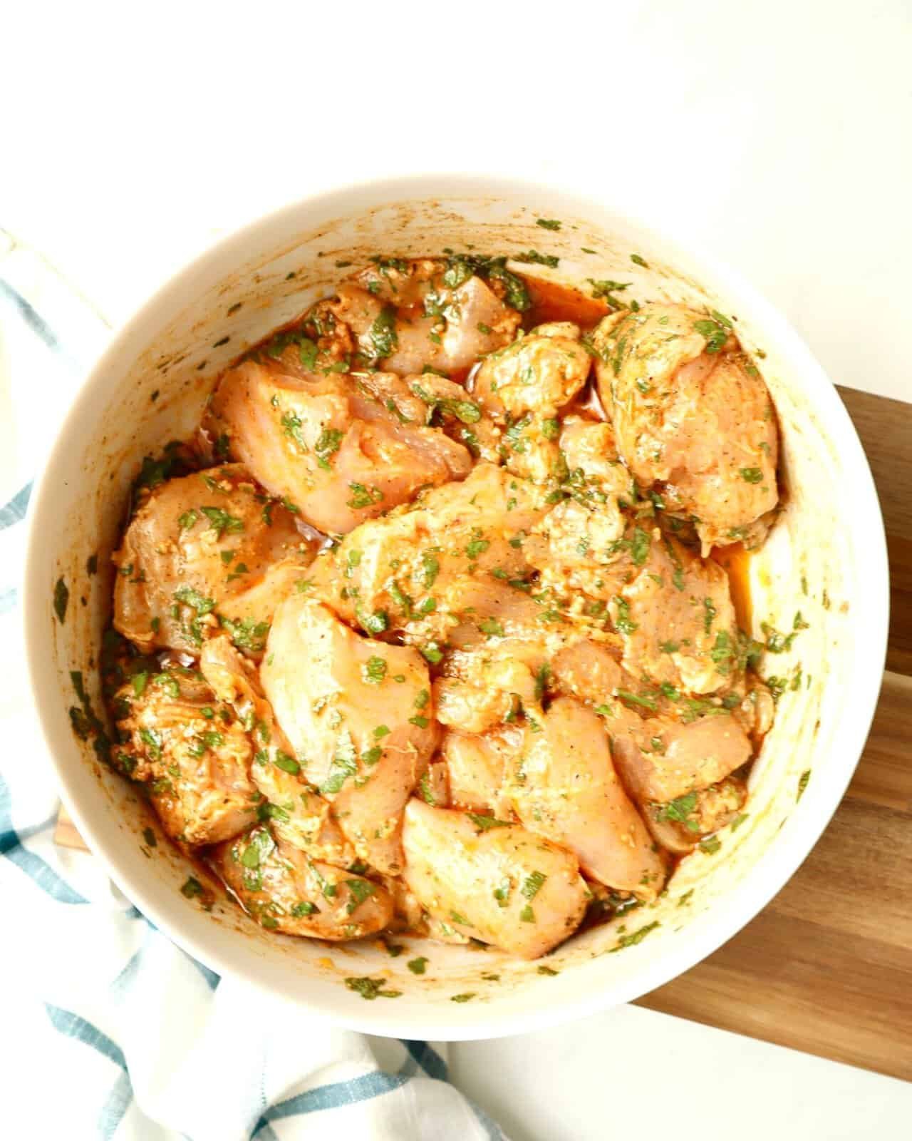 Mediterranean Herb Chicken Marinade in white bowl ready for marinating chicken