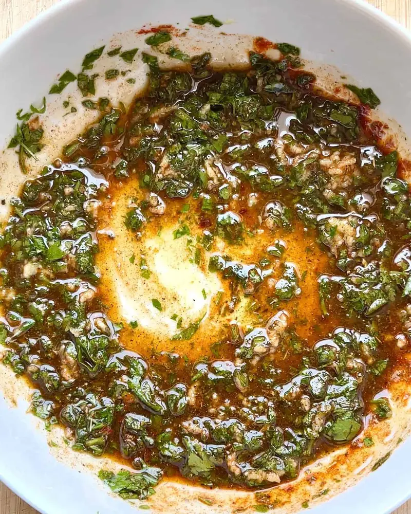 Combining Mediterranean Herb Chicken Marinade ingredients before adding chicken