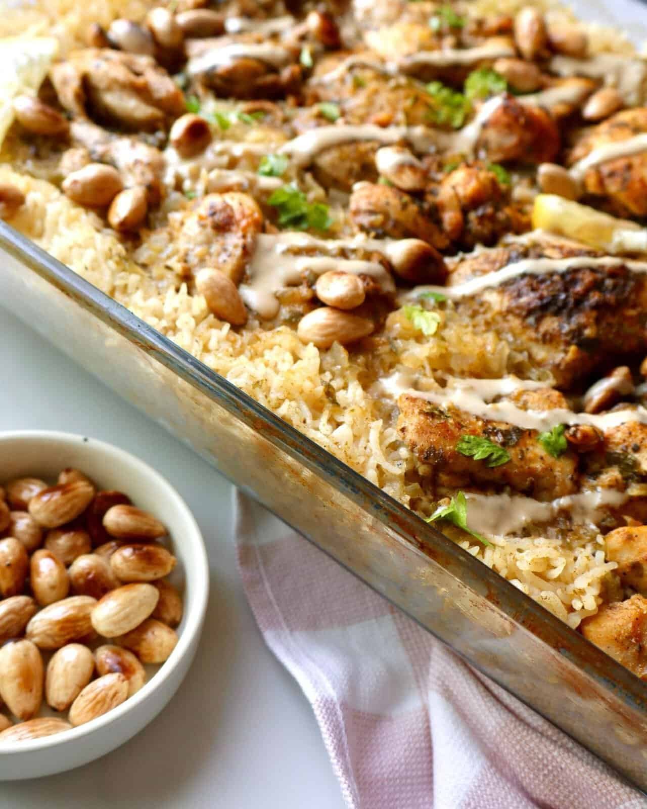Delicious Mediterranean chicken and rice bake with pine nuts and creamy sauce.
