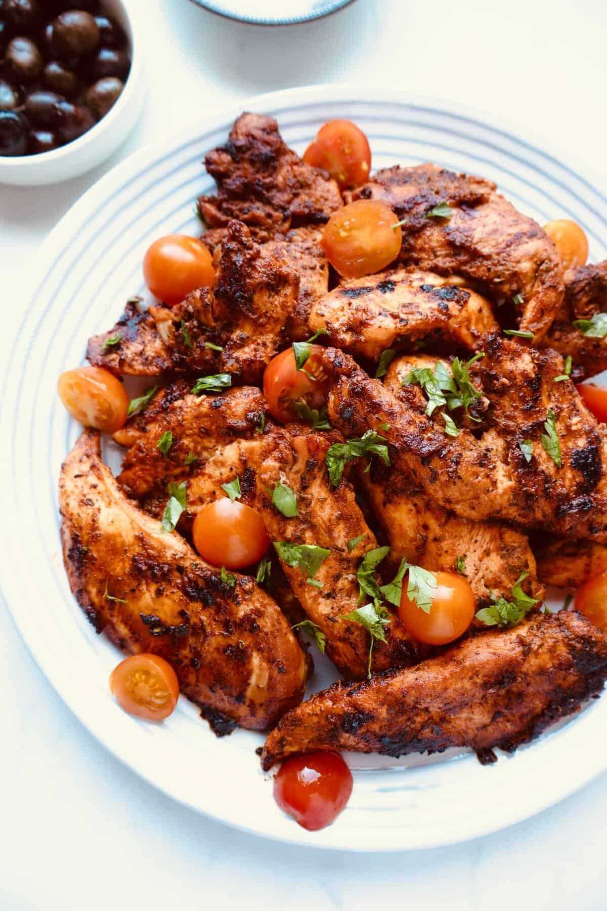 Marinated chicken breast resting after pan searing.