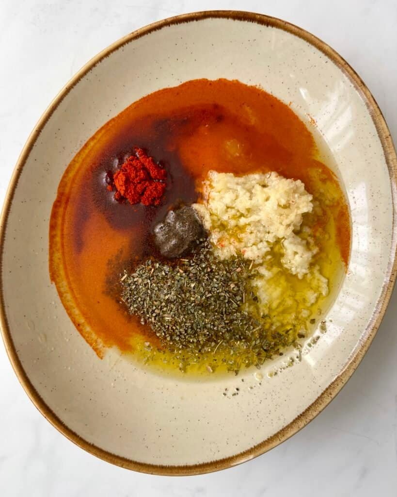 Chicken marinade ingredients in a bowl before mixing