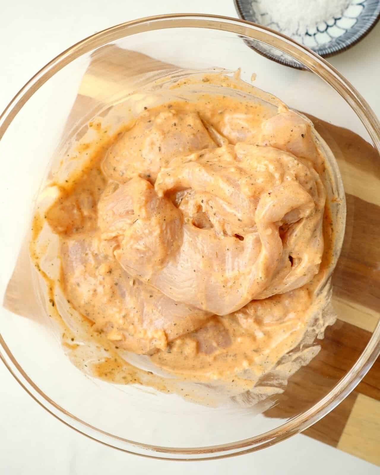 garlic yogurt chicken marinade in a clear glass bowl
