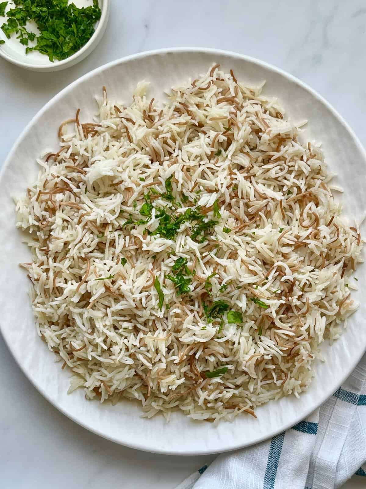 Fluffy Lebanese rice with vermicelli served warm and garnished with fresh parsley, a simple and authentic Middle Eastern side dish
