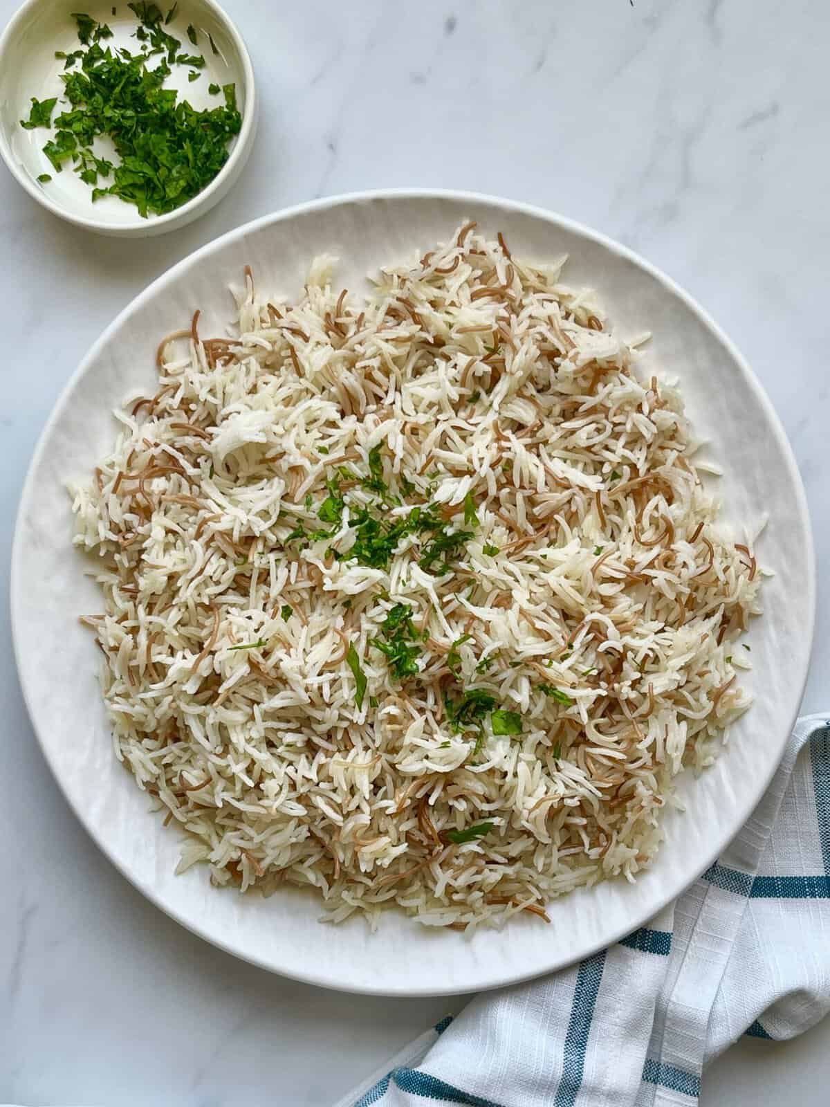 Authentic Lebanese rice with vermicelli topped with fresh parsley, showing perfectly separated grains and toasted noodles