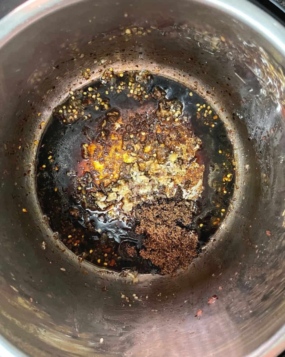 Mongolian beef sauce ingredients combined inside Instant Pot before pressure cooking