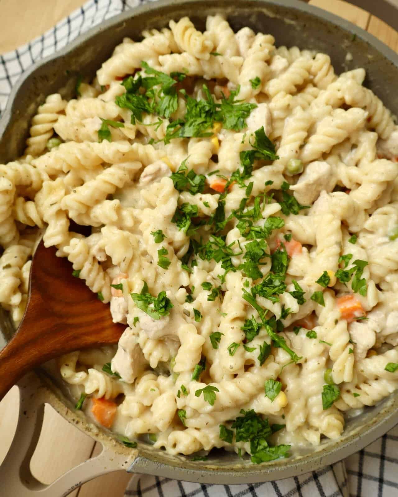 Easy One Pot Chicken Alfredo Pasta cooked in a deep skillet with tender chicken and creamy Alfredo sauce.