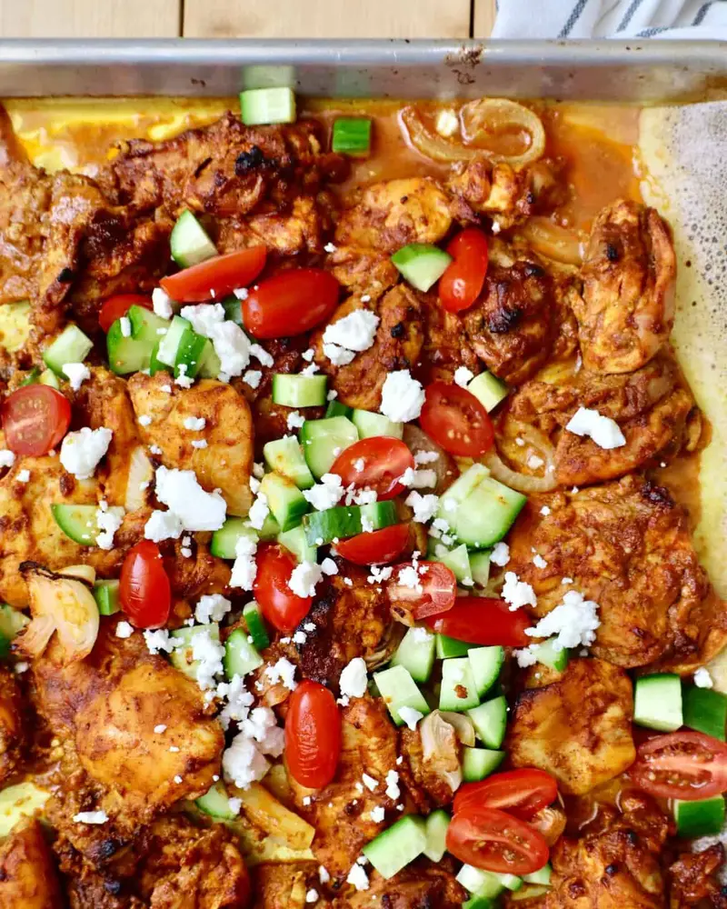 Homemade chicken shawarma featuring tender marinated chicken thighs with warm spices, garlic, lemon, and caramelized edges.