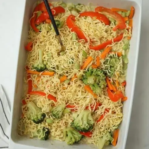 One Pan Baked Ramen Noodles with vegetables in creamy coconut ginger sauce