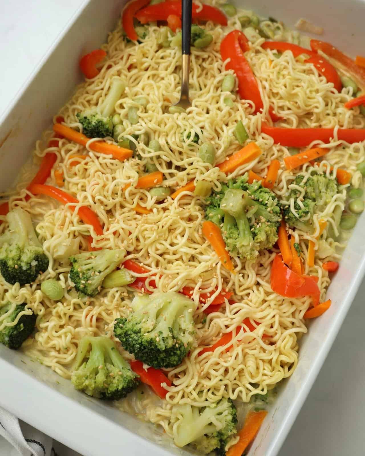 Finished One Pan Baked Veggie Ramen topped with green onions and sesame seeds